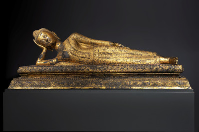 An exceptional and large Thai gilt-bronze figure of Buddha in Parinirvana, 18th C.