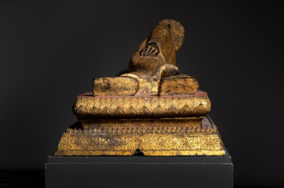 An exceptional and large Thai gilt-bronze figure of Buddha in Parinirvana, 18th C.