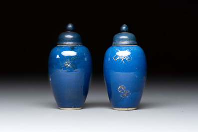 A pair of Chinese gilt-decorated powder-blue-ground miniature vases and wooden covers, 18th C.