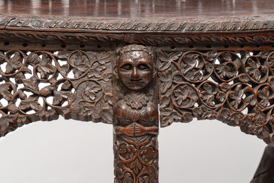 A finely carved Anglo-Indian rosewood demi-lune console table with lions, 19th C.