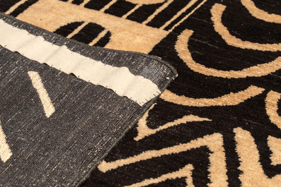 A large hand-knotted wool carpet with a symmetrical geometric composition, after a Bauhaus design by Gunta St&ouml;lzl, 20th C.