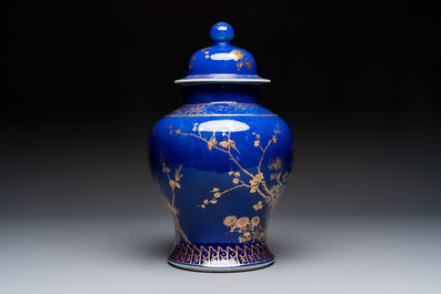 A Chinese gilt-decorated powder-blue-ground vase and cover, Kangxi mark, 19th C.