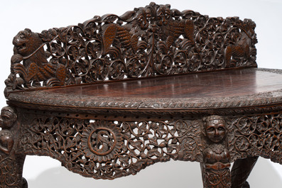 A finely carved Anglo-Indian rosewood demi-lune console table with lions, 19th C.