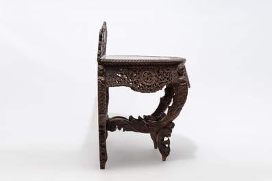 A finely carved Anglo-Indian rosewood demi-lune console table with lions, 19th C.