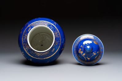A Chinese gilt-decorated powder-blue-ground vase and cover, Kangxi mark, 19th C.