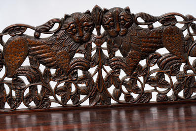 A finely carved Anglo-Indian rosewood demi-lune console table with lions, 19th C.