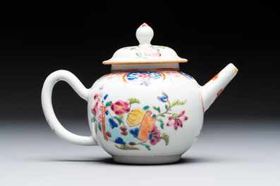 A Chinese famille rose teapot and cover with floral design and three cups, Qianlong