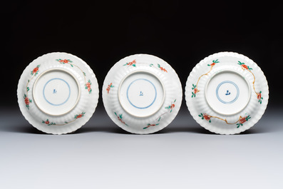 Four Chinese famille verte cups and seven saucers, 19th C.