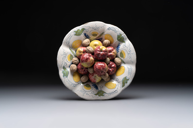 A rare polychrome Dutch Delft trompe-l'oeil dish with apples and walnuts, 17th C.