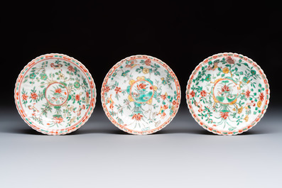Four Chinese famille verte cups and seven saucers, 19th C.