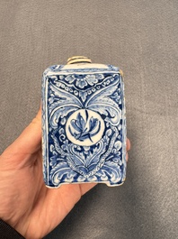 A pair of blue and white Dutch Delft square tea caddies and covers, 18th C.