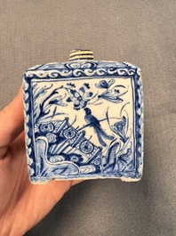A pair of blue and white Dutch Delft square tea caddies and covers, 18th C.