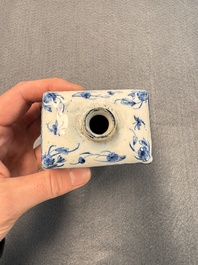 A pair of blue and white Dutch Delft square tea caddies and covers, 18th C.