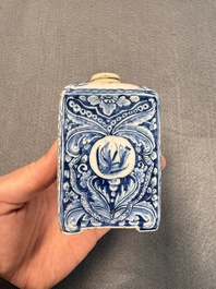 A pair of blue and white Dutch Delft square tea caddies and covers, 18th C.