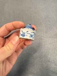 A pair of blue and white Dutch Delft square tea caddies and covers, 18th C.