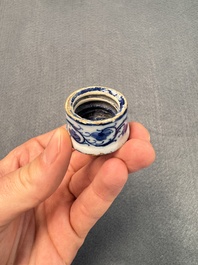 A pair of blue and white Dutch Delft square tea caddies and covers, 18th C.