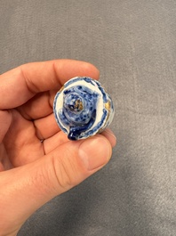 A pair of blue and white Dutch Delft square tea caddies and covers, 18th C.