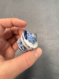 A pair of blue and white Dutch Delft square tea caddies and covers, 18th C.