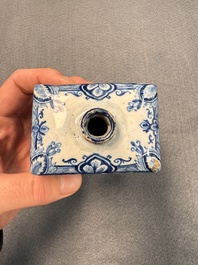 A pair of blue and white Dutch Delft square tea caddies and covers, 18th C.