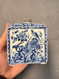 A pair of blue and white Dutch Delft square tea caddies and covers, 18th C.