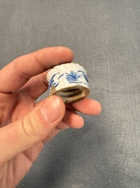 A pair of blue and white Dutch Delft square tea caddies and covers, 18th C.