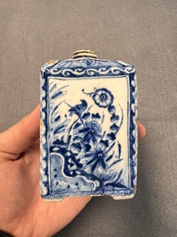 A pair of blue and white Dutch Delft square tea caddies and covers, 18th C.