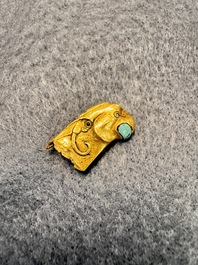 A rare Chinese turquoise- and glass-inlaid gold fitting in the form of a parrot, Han