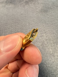 A rare Chinese turquoise- and glass-inlaid gold fitting in the form of a parrot, Han