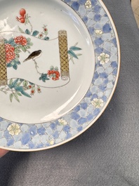 A Chinese famille rose ruby-back plate with a bird on a blossoming branch, Yongzheng