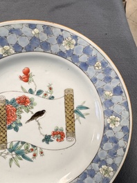 A Chinese famille rose ruby-back plate with a bird on a blossoming branch, Yongzheng