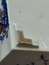 A Chinese blue, white and copper-red rectangular jardini&egrave;re with birds among flowering branches, 20th C.