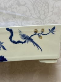 A Chinese blue, white and copper-red rectangular jardini&egrave;re with birds among flowering branches, 20th C.