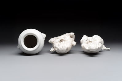 Two Chinese Dehua blanc de Chine groups of Guanyin and a vase with lion-head handles, 18th C. and later