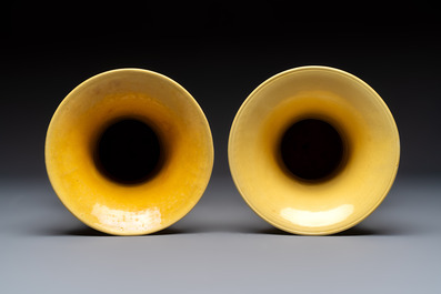 A pair of Chinese yellow-glazed 'Gu' vases with incised chilongs and landscapes, Chenghua mark, 20th C.