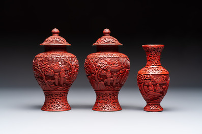A Chinese cinnabar lacquer plaque, a vase, and a pair of covered vases, 19/20th C.