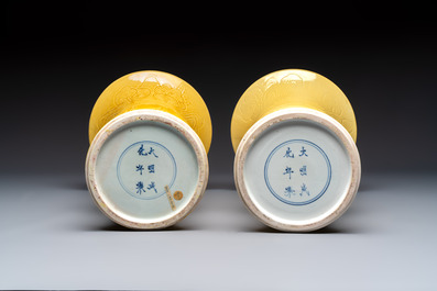 A pair of Chinese yellow-glazed 'Gu' vases with incised chilongs and landscapes, Chenghua mark, 20th C.