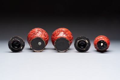 A Chinese cinnabar lacquer plaque, a vase, and a pair of covered vases, 19/20th C.