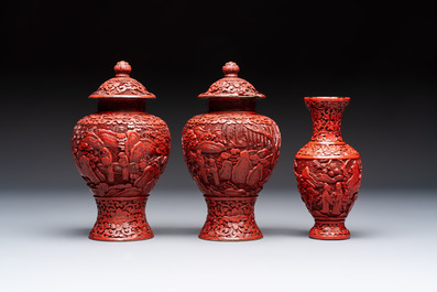 A Chinese cinnabar lacquer plaque, a vase, and a pair of covered vases, 19/20th C.