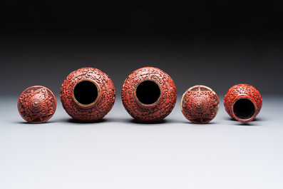A Chinese cinnabar lacquer plaque, a vase, and a pair of covered vases, 19/20th C.