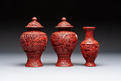 A Chinese cinnabar lacquer plaque, a vase, and a pair of covered vases, 19/20th C.