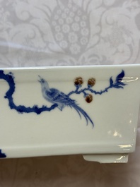 A Chinese blue, white and copper-red rectangular jardini&egrave;re with birds among flowering branches, 20th C.