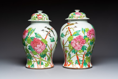 Two Chinese famille rose 'Birds among Flowering Branches' covered vases and a covered jar, 19/20th C.