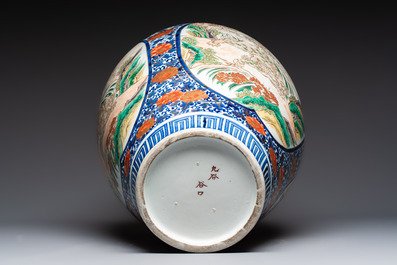 A large Japanese Imari 'Shishi Lions' vase, Kutani Taniguchi 九谷 谷口 mark, Meiji, 19th C.