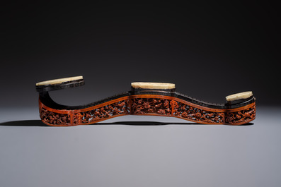 A pair of Chinese jade-inset wooden table screens, a jade-inset wooden ruyi with its original stand and a jade 'bi' disc on a wooden stand, 19/20th C.