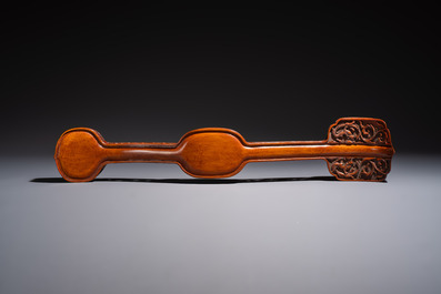 A pair of Chinese jade-inset wooden table screens, a jade-inset wooden ruyi with its original stand and a jade 'bi' disc on a wooden stand, 19/20th C.