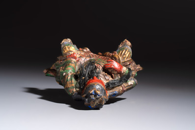 A Chinese gilt and polychrome lacquered papier-m&acirc;ch&eacute; and wooden Guandi on a wooden stand, 19th C.