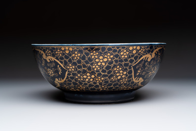 A gilt-decorated powder-blue-ground punch bowl and a pair of Imari-style jars, Samson, Paris, 19th C.