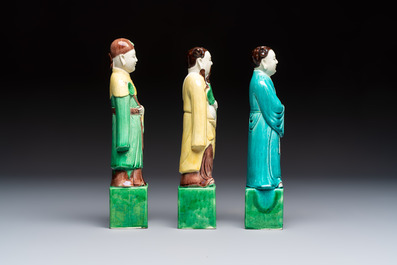 A pair of Chinese famille rose elephants carrying a 'Gu' vase and three sancai-glazed immortals, 20th C.