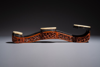 A pair of Chinese jade-inset wooden table screens, a jade-inset wooden ruyi with its original stand and a jade 'bi' disc on a wooden stand, 19/20th C.