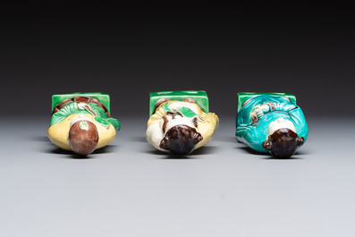 A pair of Chinese famille rose elephants carrying a 'Gu' vase and three sancai-glazed immortals, 20th C.